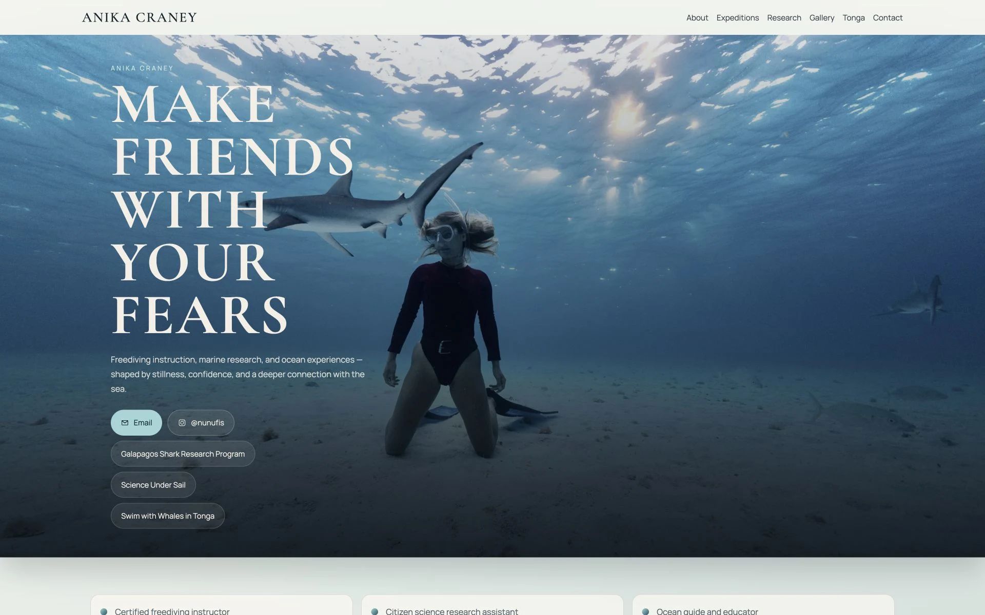 Lumara website: a freediver and shark underwater.